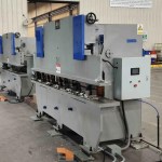 The offline holes punching station, featuring hydraulic or mechanical presses equipped with multiple dies to create precise mounting holes and slots in the roll-formed solar panel frame profiles.